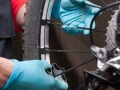 Mechanical adjusting the spokes of a bicycle